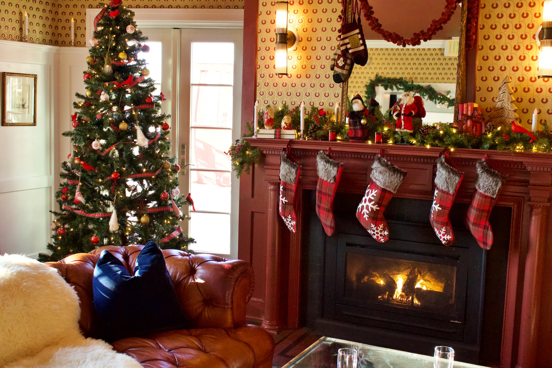 Living Room with Christmas Tree and Stocking Hanging over the Fireplace
